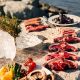 A selection of greenlandic meat being prepared on the rocks in Nuuk in Greenland. Photo by Rebecca Gustafsson - Visit Greenland
