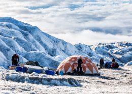 Adventurers settling in at Camp Ice Cap on the Greenland Ice Sheet, run by Albatros Arctic Circle in Kangerlussuaq. Photo by Raven Eye Photography