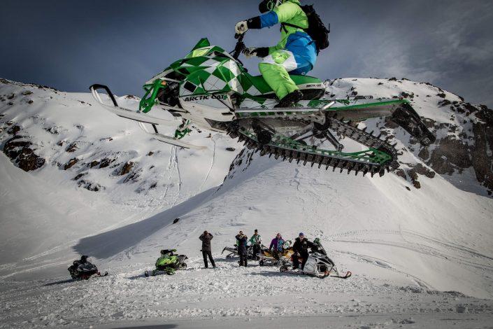 Flying high on a snowmobile near Sisimiut in Greenland. Photo by Mads Pihl.