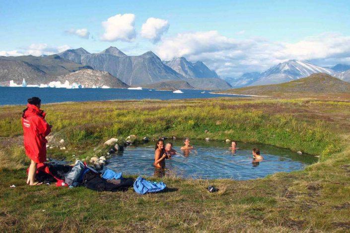 Hikers relaxing at the hot springs in Uunartoq. Photo by Tasermiut South Greenland Expeditions, Visit Greenland