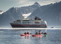Kayakers in front of MS Fram in North Greenland near Illorsuit. By Mads Pihl