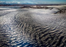 Lines in the ice sheet seen from an Air Zafari flight near Kangerlussuaq in Greenland. Photo by Mads Pihl