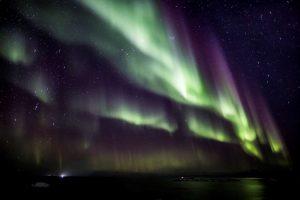 Northern Lights also known as Aurora Borealis filling up the night sky. Photo by Nanu Travel