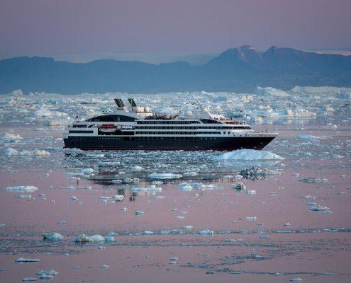 Ponant Cruises L'Austral in early morning light near Ilulissat in Greenland. By Mads Pihl