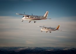 Two flightseeing planes from Air Zafari over the hills around Kangerlussuaq in Greenland. Photo by Mads Pihl