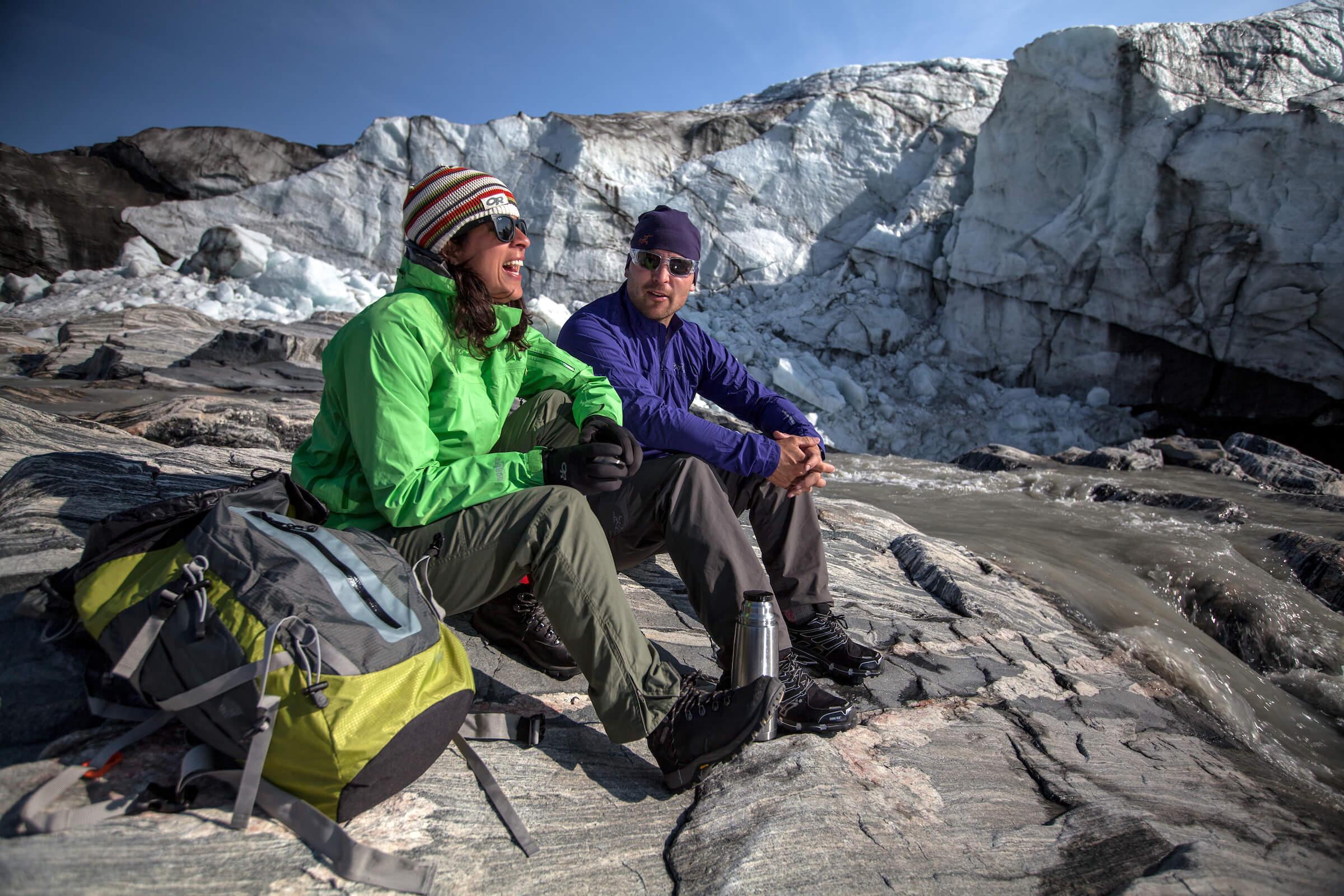 Two hikers enjoying a day in the sun by the Russell Glacier near Kangerlussuaq in Greenland. Photo by Mads Pihl