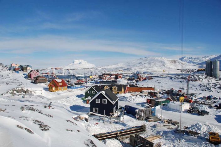 View over snowy mountains and parts of Nuuk. Photo by vandrehuset.com, Visit Greenland